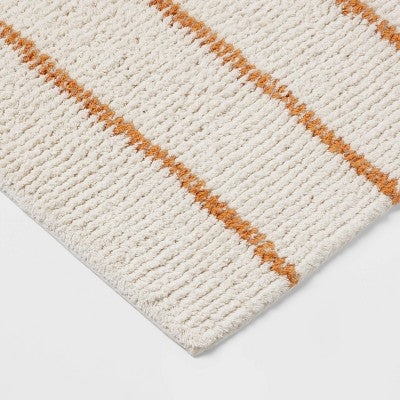  20"x30" Modern Tufted Stripe Bath Rug Yellow/Cream - Threshold™