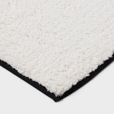  24"x36" Oversized Border Bath Rug Black/White - Threshold™